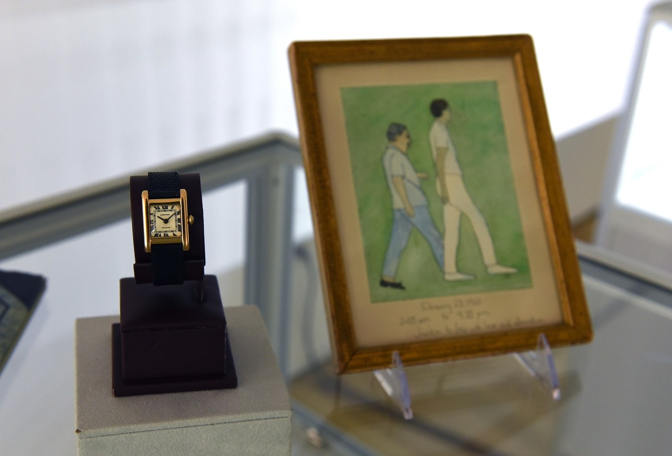 The watch and the painting won by Kim Kardashian