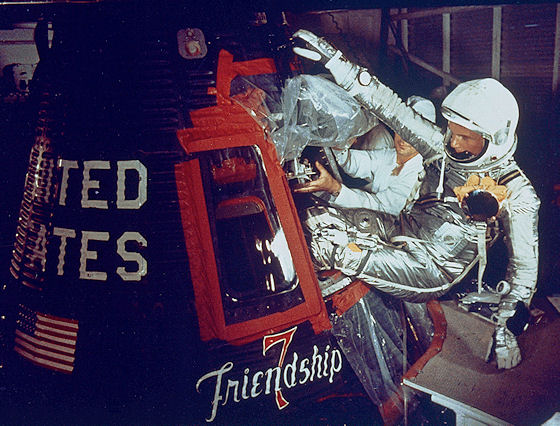 Astronaut John Glenn enters the Friendship 7 capsule wearing a Heuer stopwatch on his wrist.