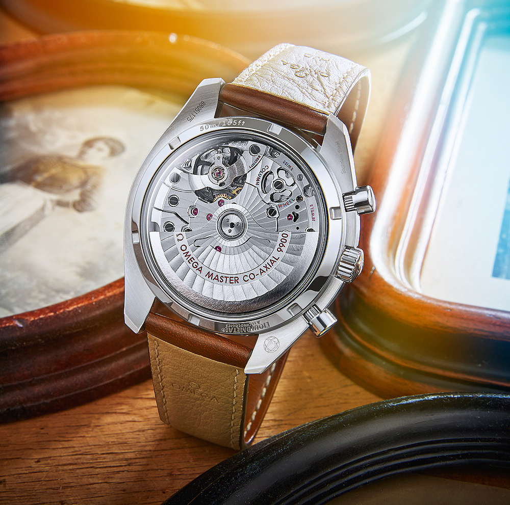 The Omega Master Co-Axial Caliber 9900 is visible through the caseback.