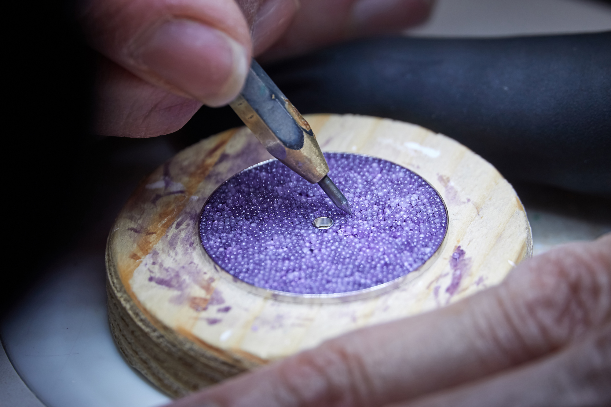 Each of the sugar crystals are then placed on the dial one-by-one by hand.