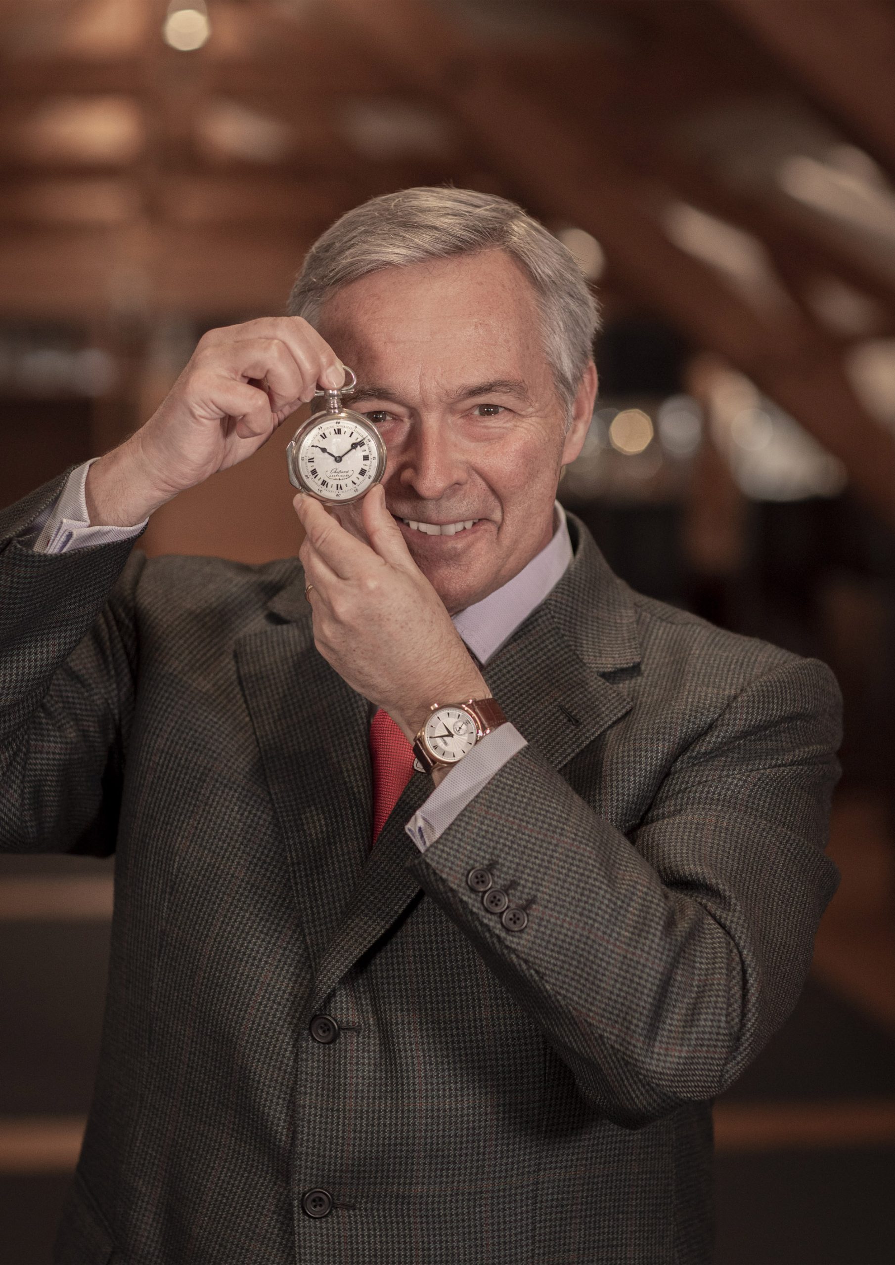 Karl-Friedrich Scheufele holding Louis-Ulysse Chopard's first pocket watch & wearing the first L.U.C wristwatch.jpg