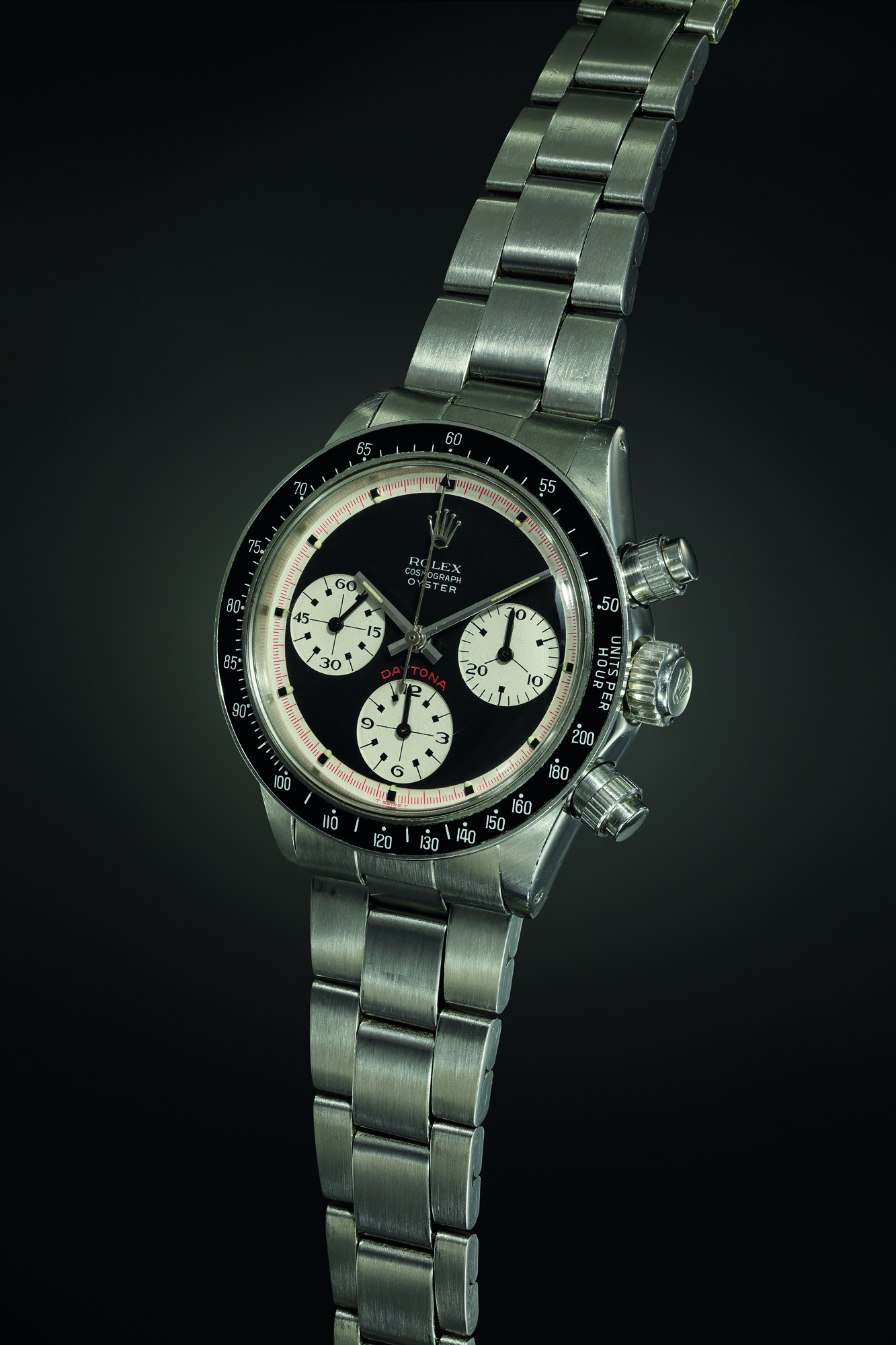An exceedingly rare, magnificent and early chronograph wristwatch with ‘Oyster Sotto Paul Newman’ dial, tachymeter bezel.. Realised CHF 1,662,500.