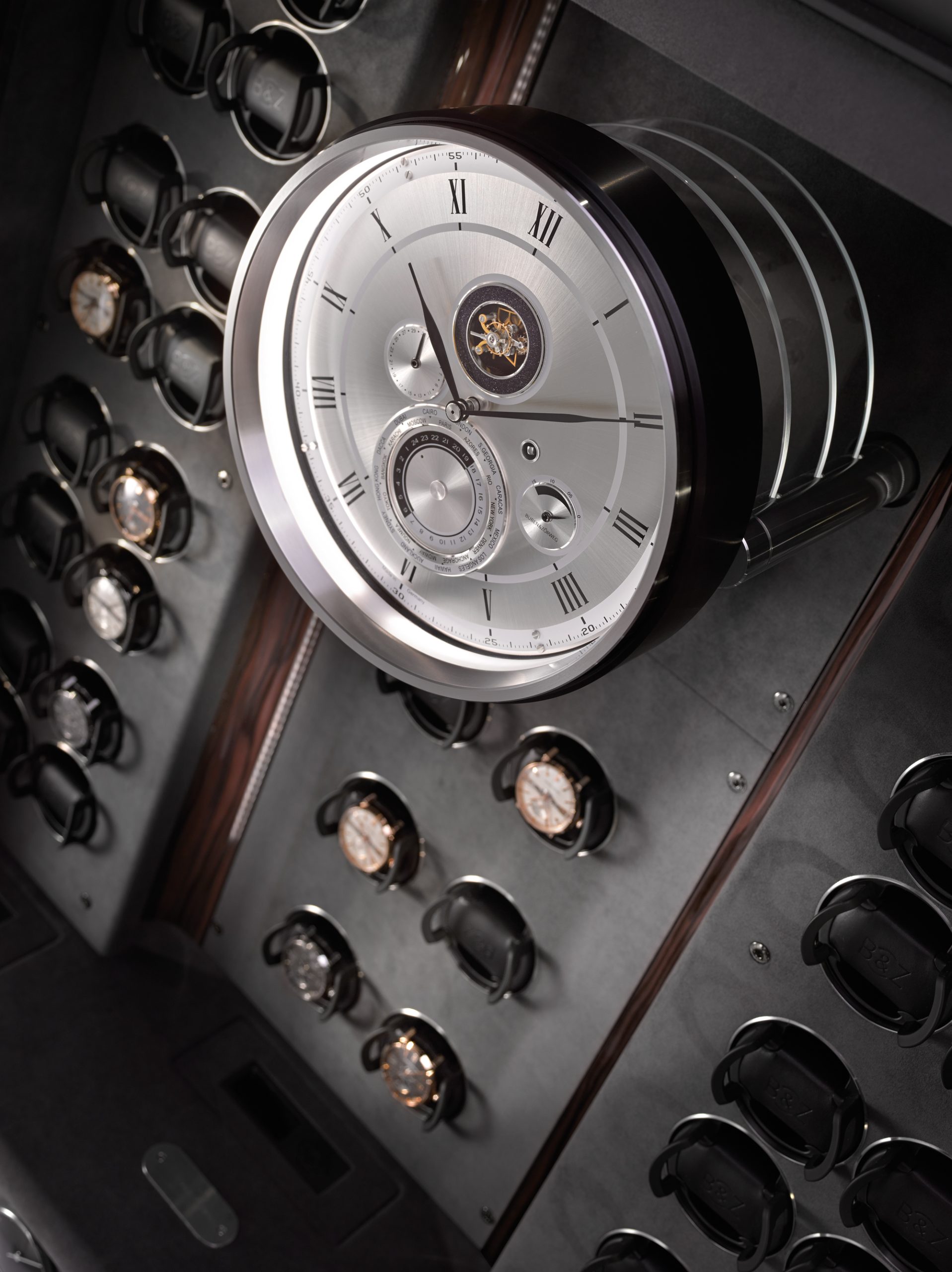 The new Solitaire Vision is the most recent example of the BUBEN&ZORWEG Object of Time® collection. Its inner values, protected by bullet-proof spy glass, inspire a high sense of security and strength. Within, 46 Time Mover® can hold a collection of automatic watches, some of them in the integrated VdS-certified safe that forms the core of the whole ensemble. The clock is a central element and a highlight of the Objects of Time®. Featuring a world time indication and a tourbillon escapement, it connects the interior with the exterior, between the closed and the inviting open state.