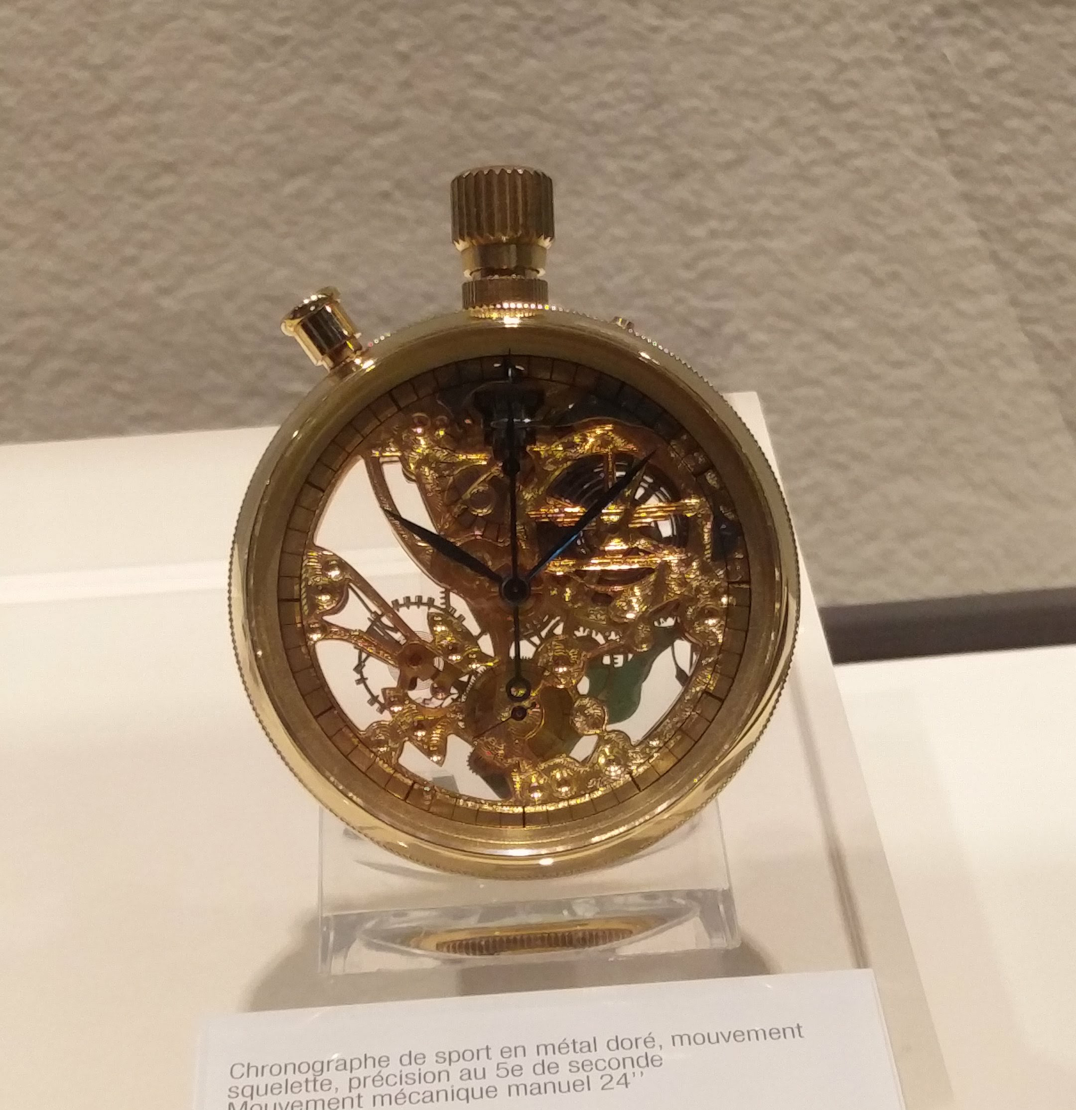 Gold-plated base metal sports timer skeleton movement, fifths of a second. 