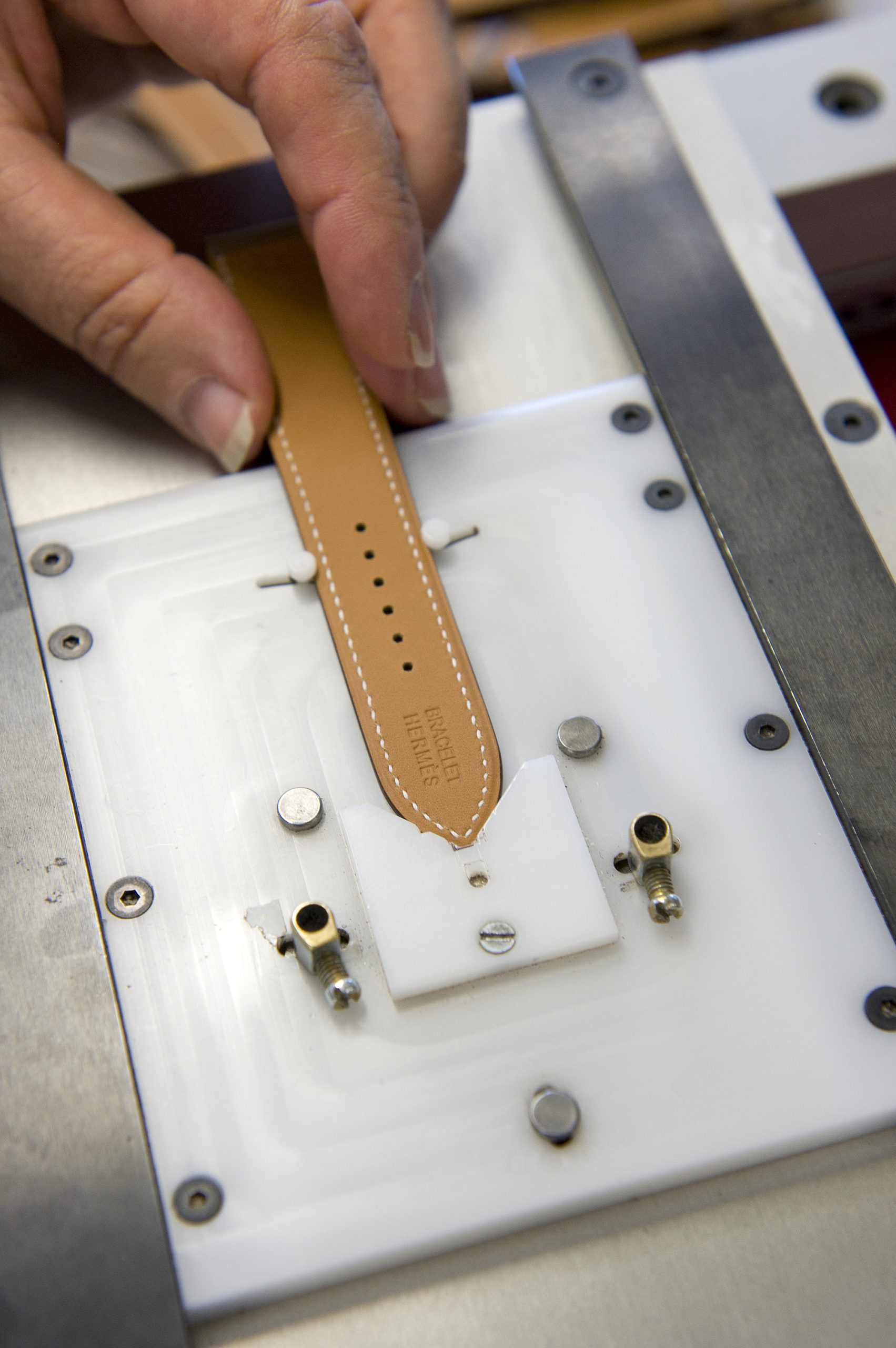 After the needle comes the hammer. Hermès will not accept protruding seams, so the strap makers gently rap and tap with their hammers until each strap is flat and smooth.