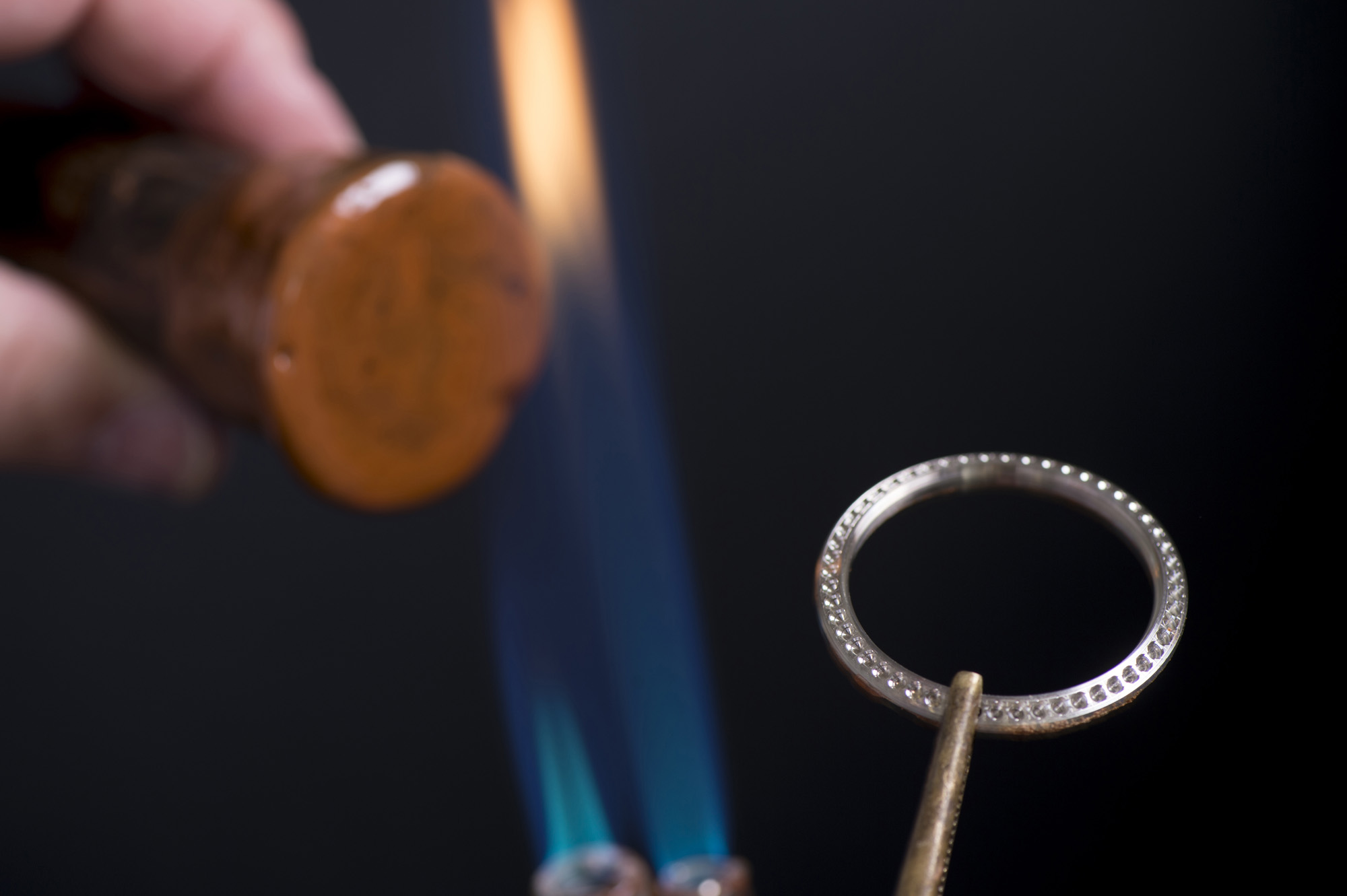 Once the seats are created to house the stones, several techniques are used to set the gem stones. An example of one is bezel setting. Traditional bead setting done using stones of similar size held by four beads.