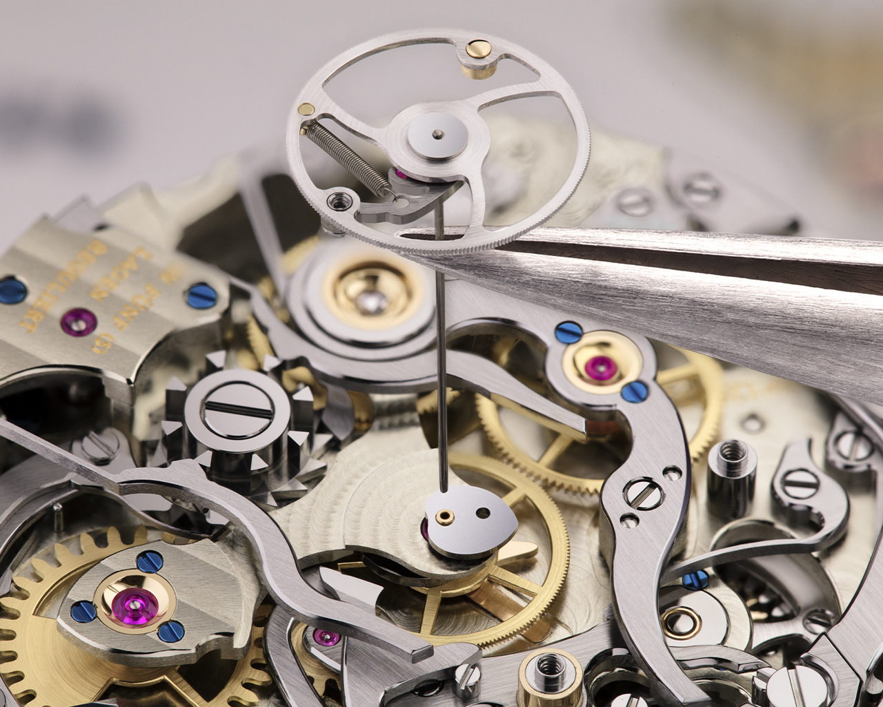 The rattrapante hand arbor is about one centimetre long and extends from the dial to the rattrapante wheel on the opposite side of the movement. The arbor is turned from one piece of round hardened steel and painstakingly trued by hand. Then, it is passed through the hollow chronograph hand arbor.