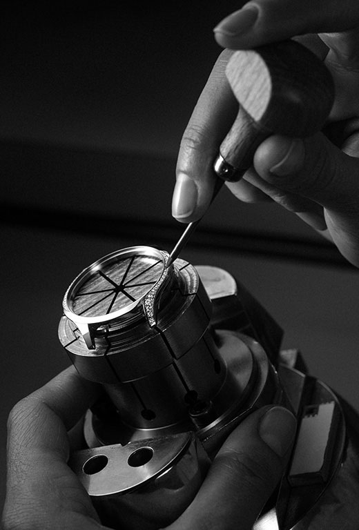 Then you fix the diamonds by folding over the four-tiny-but-tough clasps surrounding each diamond