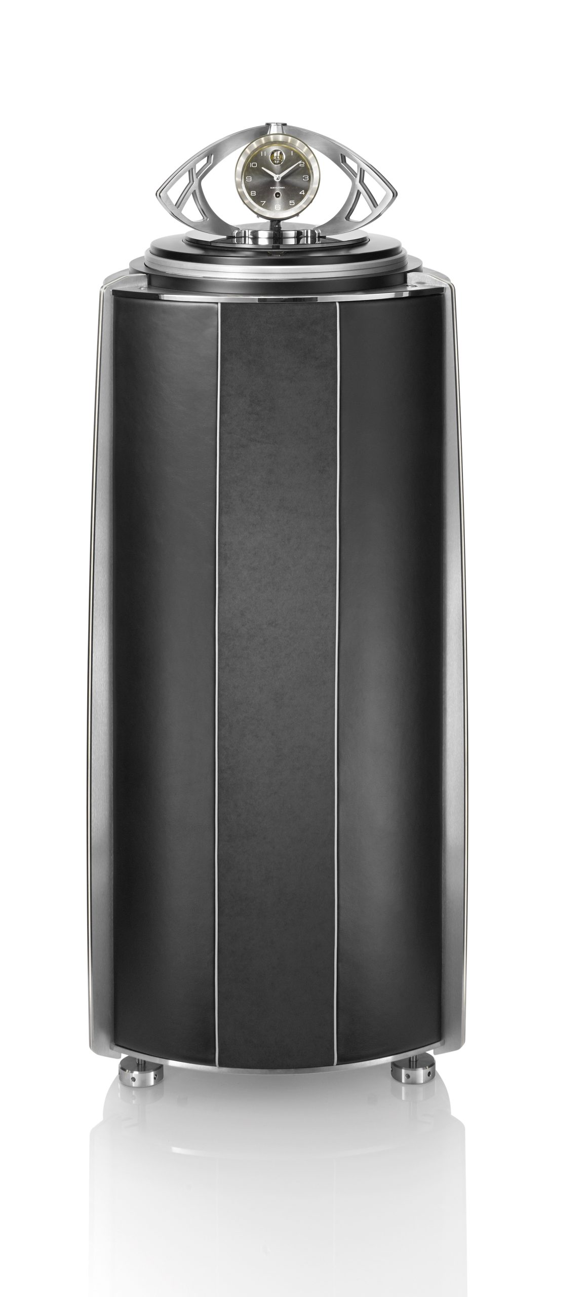 The GRANDE ILLUSION, an upscale version of the Illusion, showcases all the possibilities of this creative concept by almost tripling the storage capacity of the smaller ILLUSION. The GRANDE ILLUSION elevates its contents out of a shaped column masterfully covered in fine leather and Alcantara, crowned by an optional Fine Timepiece with a BUBEN&ZORWEG signature movement. A sculpture-like creation that draws inspiration directly from the famous Clock Tower in Dubai.