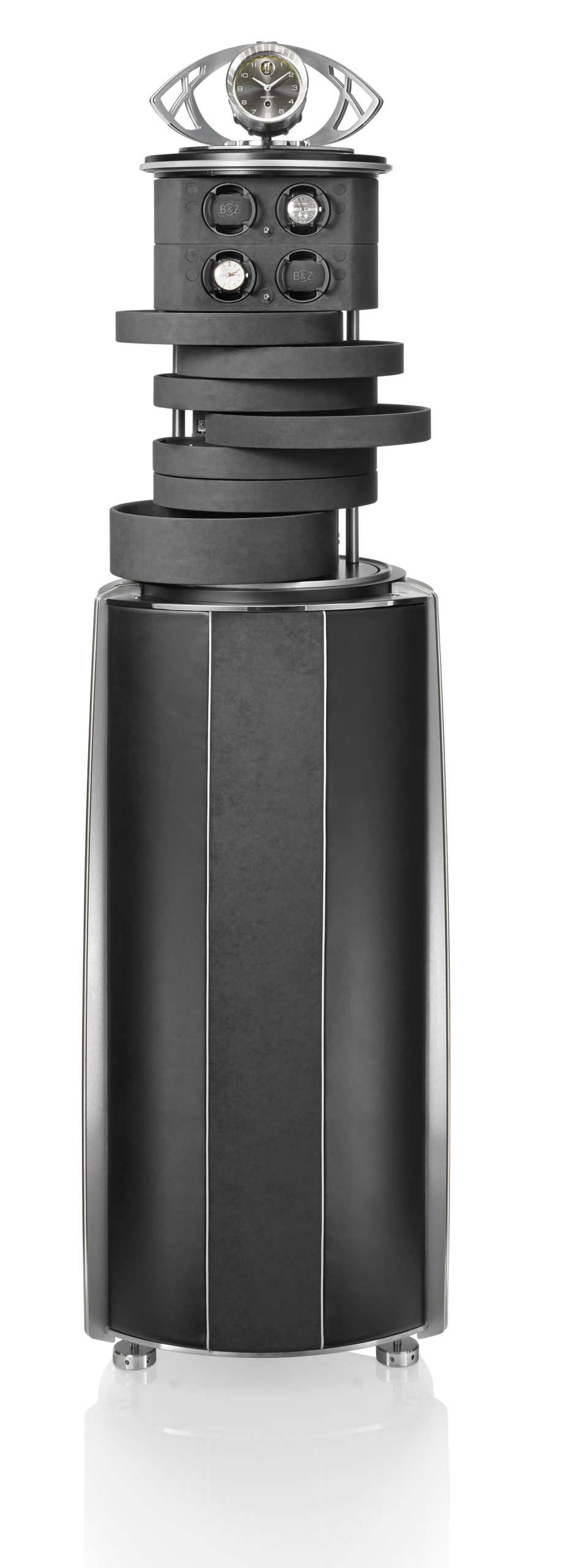 The GRANDE ILLUSION, an upscale version of the Illusion, showcases all the possibilities of this creative concept by almost tripling the storage capacity of the smaller ILLUSION. The GRANDE ILLUSION elevates its contents out of a shaped column masterfully covered in fine leather and Alcantara, crowned by an optional Fine Timepiece with a BUBEN&ZORWEG signature movement. A sculpture-like creation that draws inspiration directly from the famous Clock Tower in Dubai.