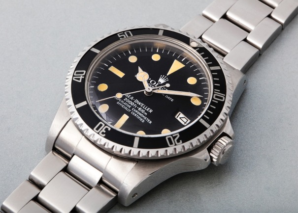 An extremely rare and historically important stainless-steel prototype wristwatch with “Single Red” dial, no helium valve case, formerly the property of Robert Palmer Bradley. World record for any Rolex Sea-Dweller ever sold at auction.