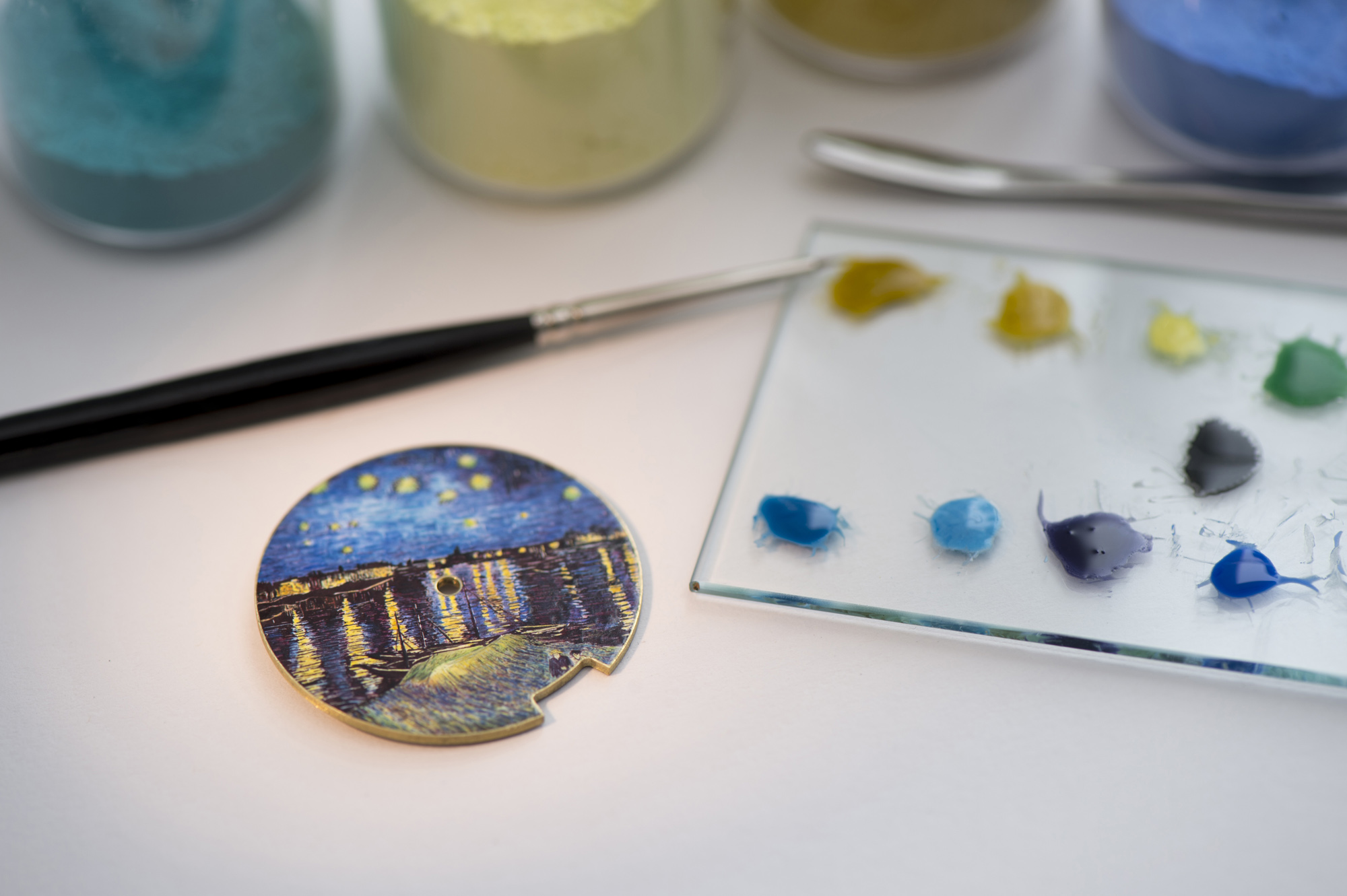 Six to ten layers of transparent protective enamel are then applied to the dial that is carefully sanded and polished to achieve a shiny, finely glazed appearance.