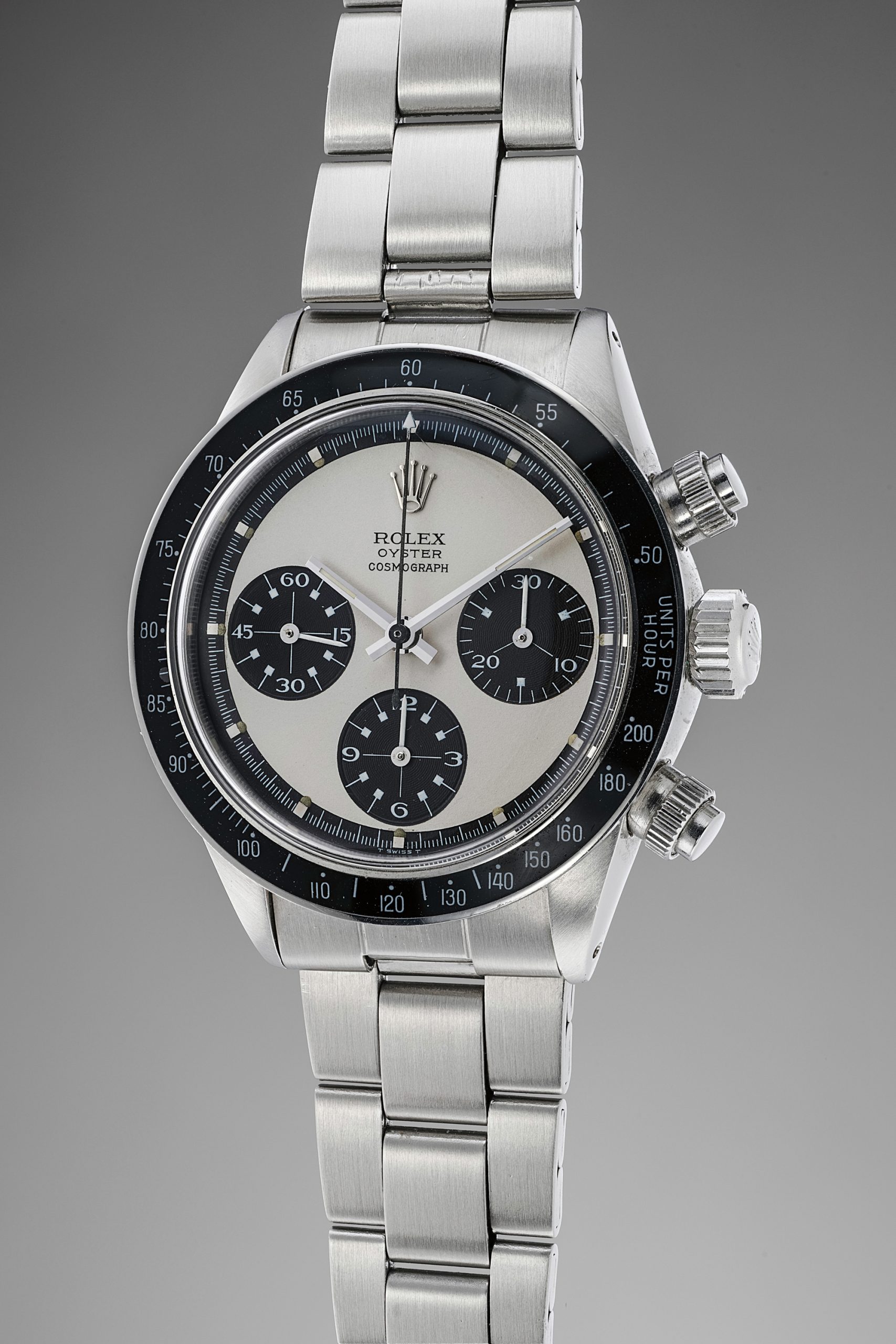 A very well preserved and extremely rare stainless-steel chronograph wristwatch with Mark 2 “Paul Newman” dial and bracelet with original guarantee and box.