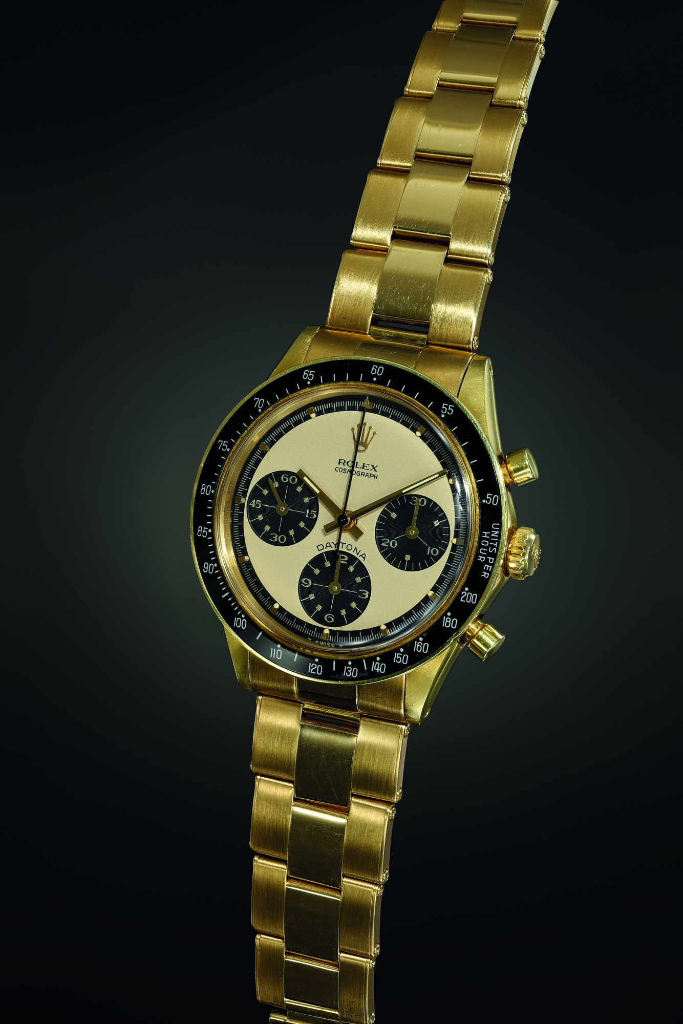 A rare, beautiful and well-preserved yellow gold chronograph wristwatch with champagne ‘Paul Newman’ dial and bracelet. Realised CHF 516,500
