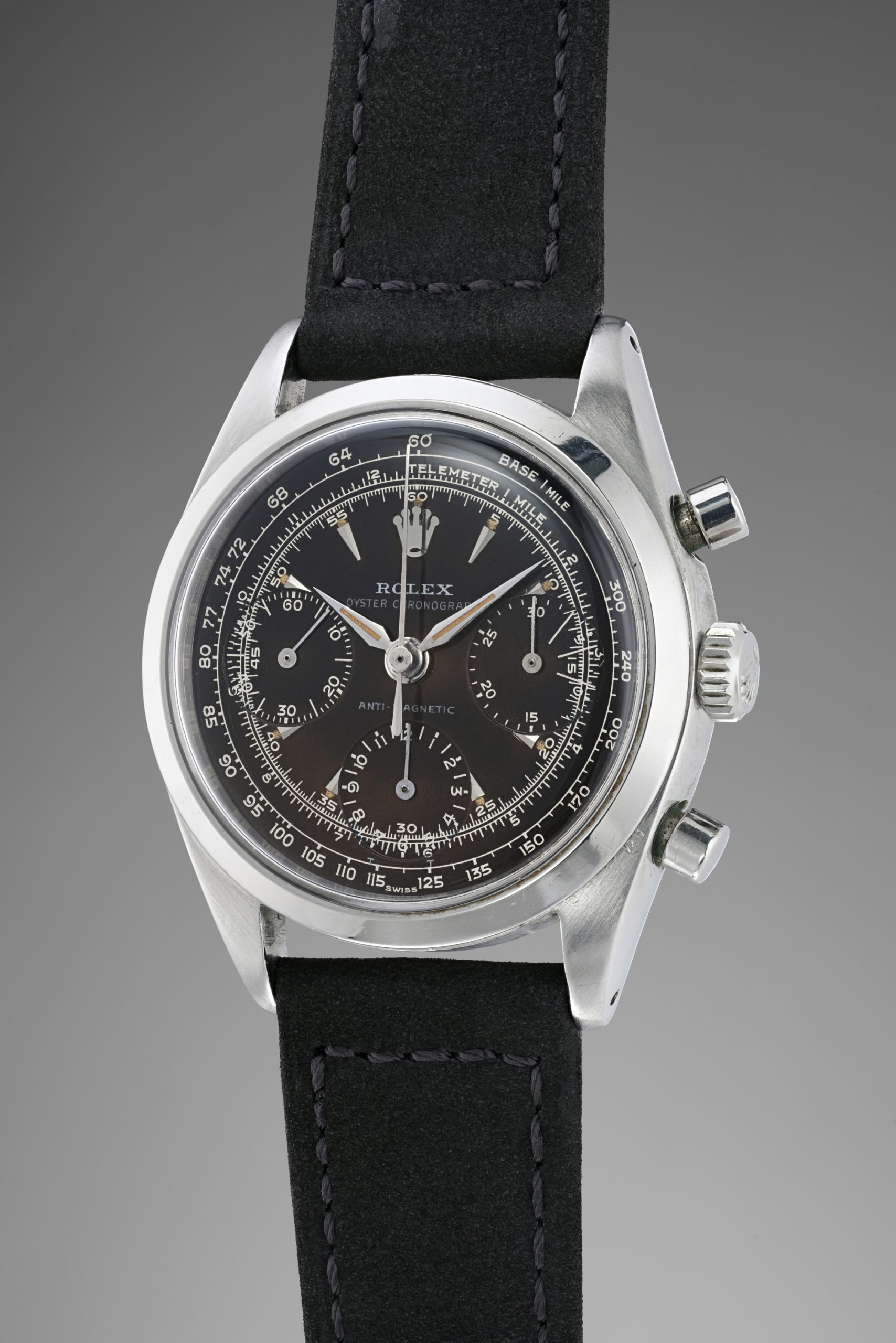 A fine, extremely rare and highly important stainless-steel chronograph wristwatch “Suspended T” degrade brown tropical glossy dial. World record for this reference at auction.